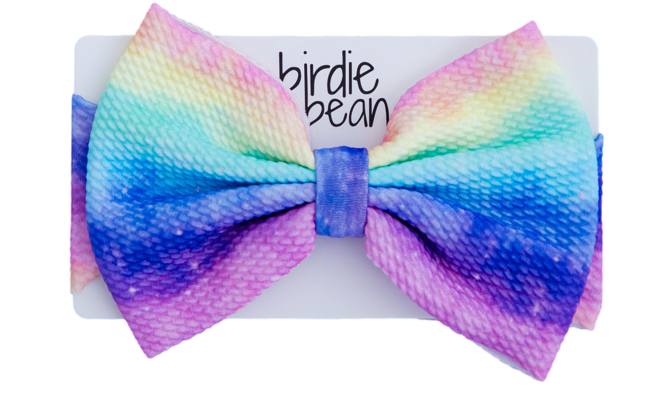 Colorful bow headband with gradient effect on a white background